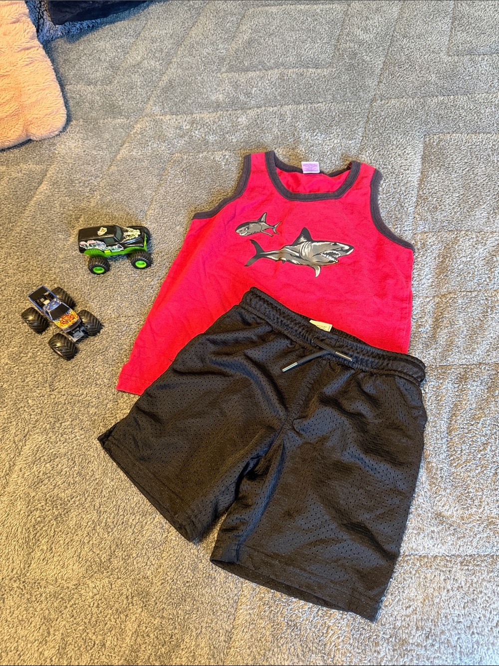 Red Shark Tank Top with Black Athletic Shorts
